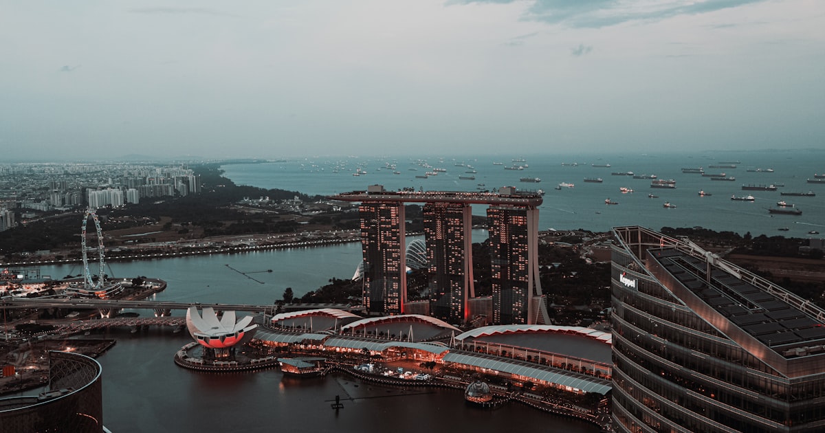 Aerial view of Singapore skyline showing mix of residential and commercial buildings