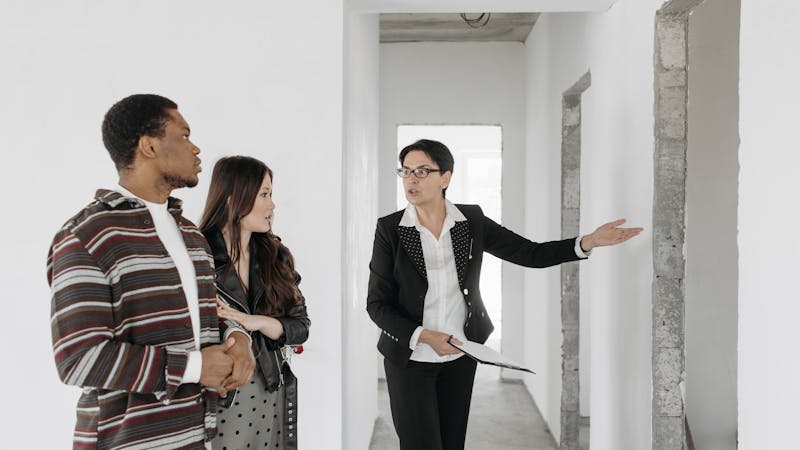 Property agent showing apartment to couple during a viewing session