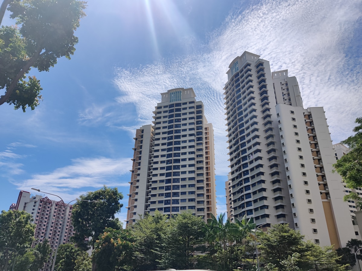 Singapore high-rise buildings surrounded by green trees near one-north district