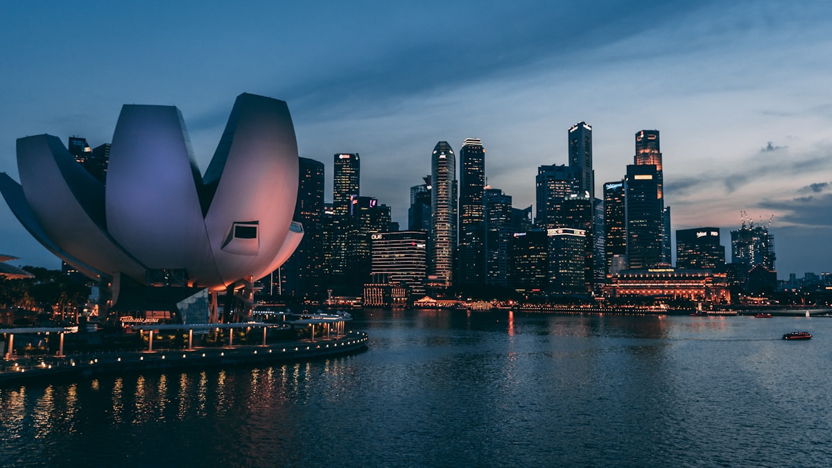 Singapore Marina Bay CBD skyline at dusk with the ArtScience Museum, representing the broader Singapore property market and 2026 rental slowdown