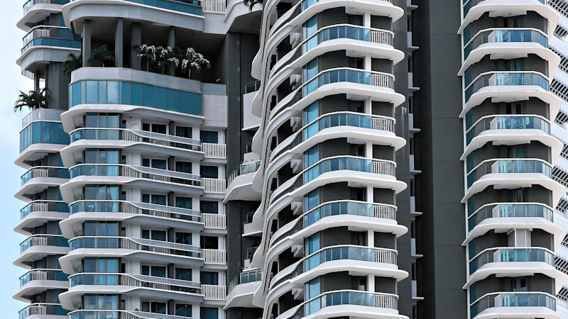 Luxury condominium tower with curved balconies in Singapore